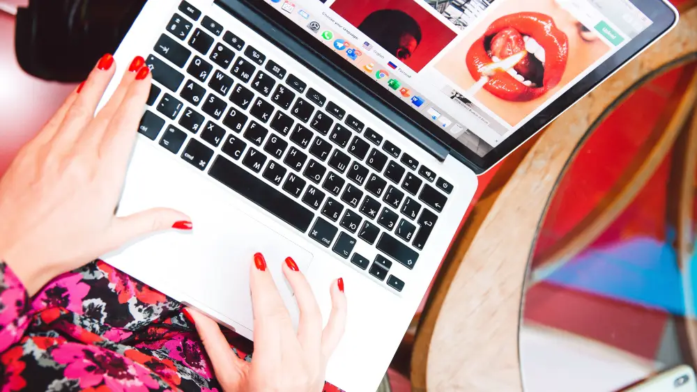 Woman Using Laptop With Remote Working Tools For Marketing Teams
